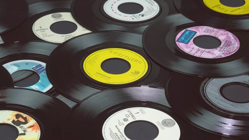 Stack of black vinyl records seen close-up
